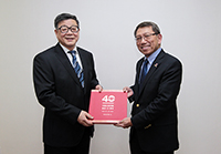 Prof. Wang Weiguang (left), President of CASS, presents a commemoration publication of CASS’s 40th Anniversary to Vice-Chancellor Prof. Rocky Tuan